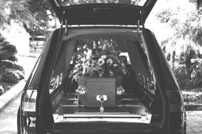 Topics of Bible and Suicide with an image of a hearse